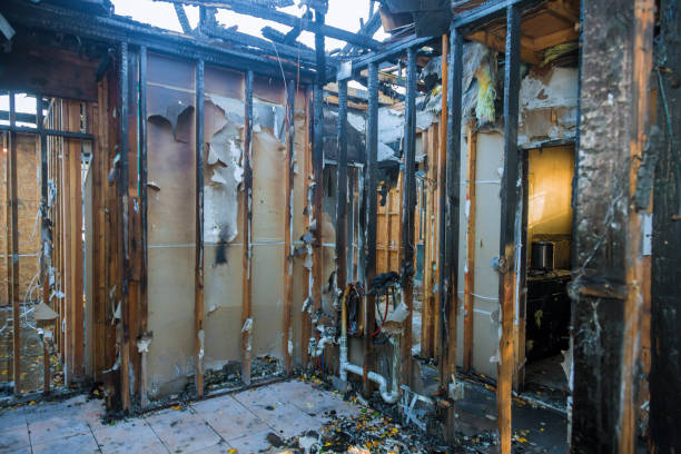 Professional Fire Damage Restoration technician working in Byram, CT